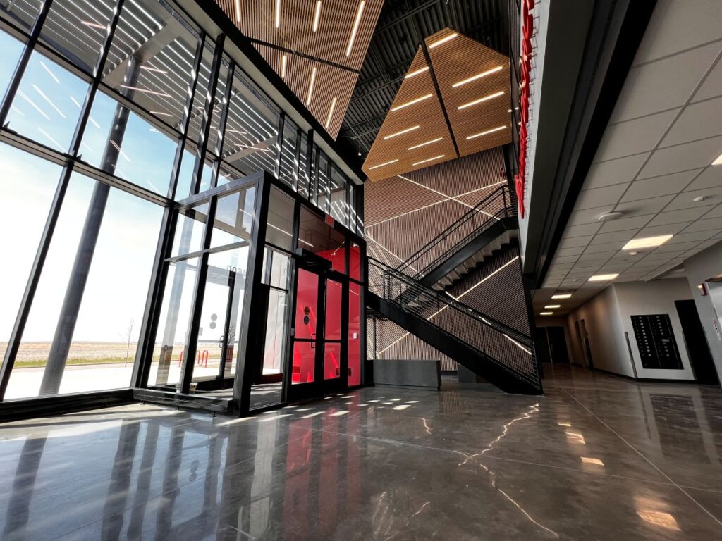 The main entry of Building 1 at the USD Discovery District features slated food paneling and natural light.