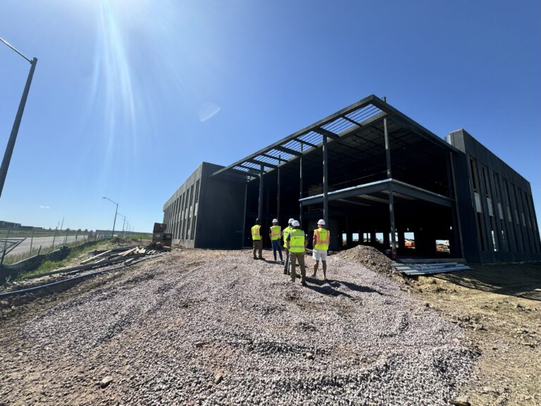 USD Discovery District construction team walks the site of a new construction building.
