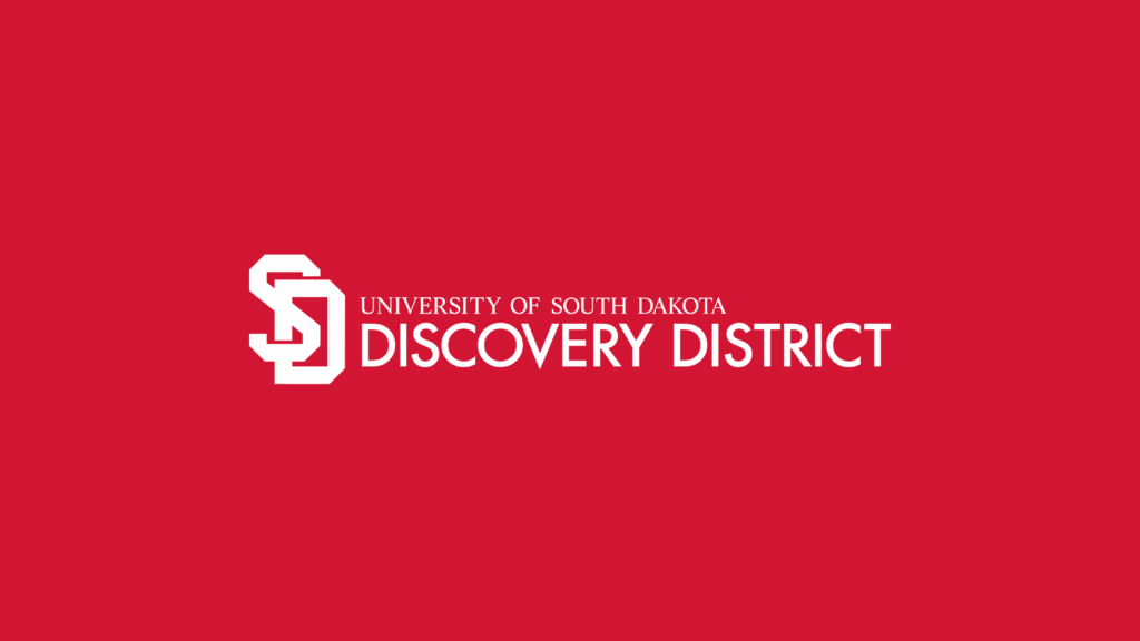 University of South Dakota Discovery District brand logo on red field.