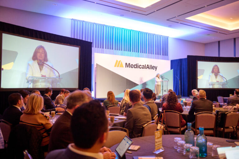 Tung Nguyen and partners at the 2026 Medical Alley Summit in Minneapolis discussing bioscience and healthcare innovation.