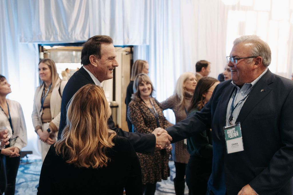 Governor Larry Rhoden shaking hands with Dana Dykhouse at South Dakota innovation event